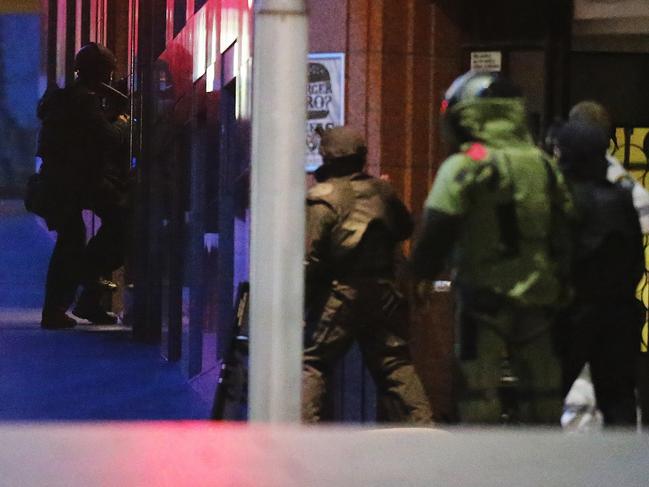 Police storm the Lindt Cafe where gunman Man Monis had been holding hostages for 16 hours. Picture: Getty Images