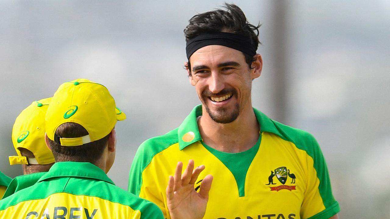 Mitchell Starc (R) of Australia celebrates the dismissal of Kieron Pollard of West Indies during the 3rd and final ODI between West Indies and Australia at Kensington Oval, Bridgetown, Barbados, on July 26, 2021. (Photo by Randy Brooks / AFP)