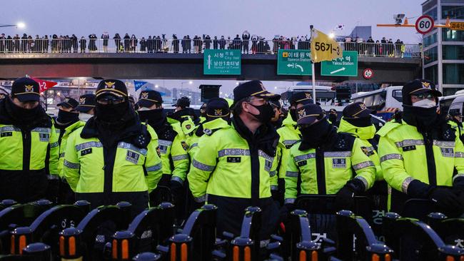 Police officers stand guard at rallies against and in support of impeached South Korea's president Yoon Suk Yeol near his residence in Seoul. Picture: AFP.