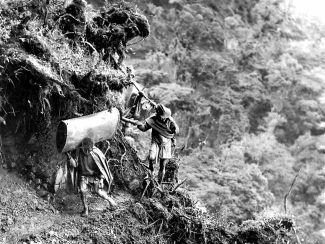 Diggers negotiate a tricky part of the Kokoda Track in 1944.