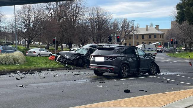 Emergency services block off the scene where a two vehicle fatal crash killed an 18-year-old man from Hobart and three others. Brooker Highway and Bathurst St intersection. July 21, 2024.