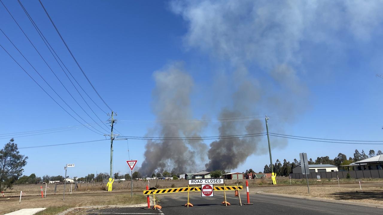 A large grass fire is threatening homes on the eastern side of Dalby, near the intersection of the Warrego Highway and Dalby-Cecil Plains Road.