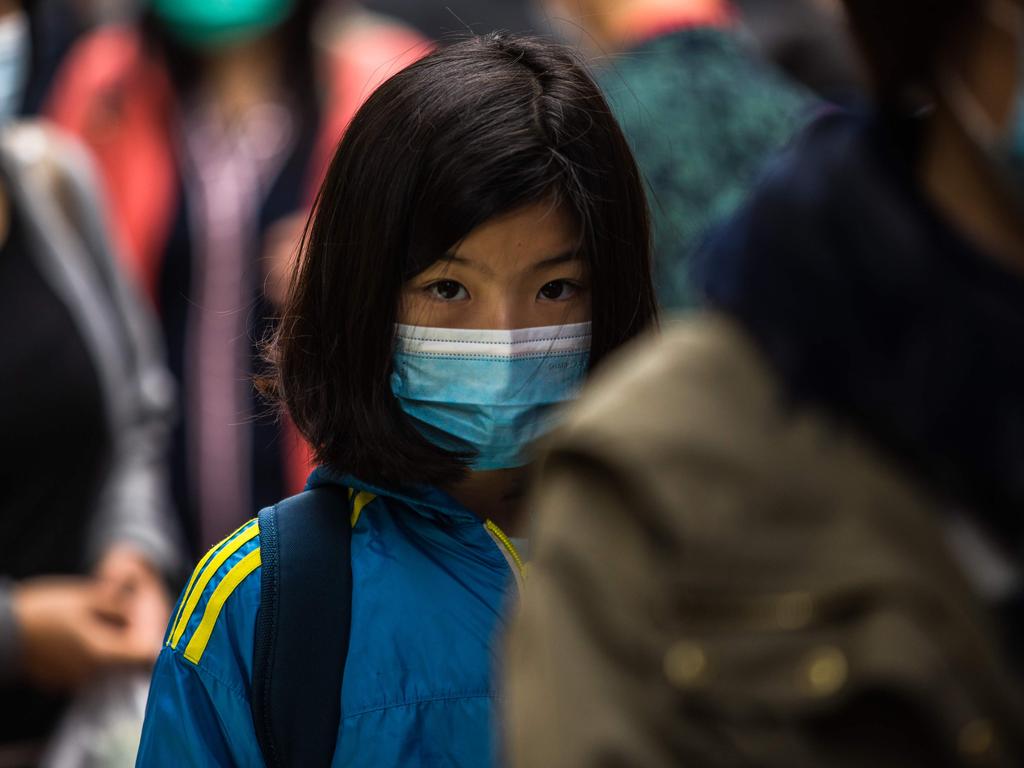 People wearing protective face masks in Hong Kong. Picture: Dale De La Rey/AFP