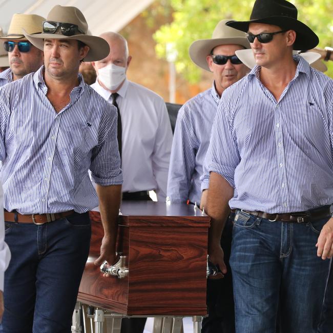 Outback Wrangler, Matt Wright (L) among the Pall Bearers for his mate, local Civil Engineer and TV Star Chris ’Willow’ Wilson at the Darwin Convention centre. Picture: Glenn Campbell