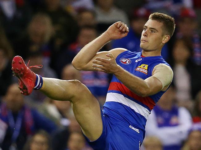 AFL Round 4. 14/04/2018. Western Bulldogs vs Sydney Swans at Etihad Stadium.  Western Bulldogs Josh Dunkley kicks at goal 3rd qtr  . Pic: Michael Klein