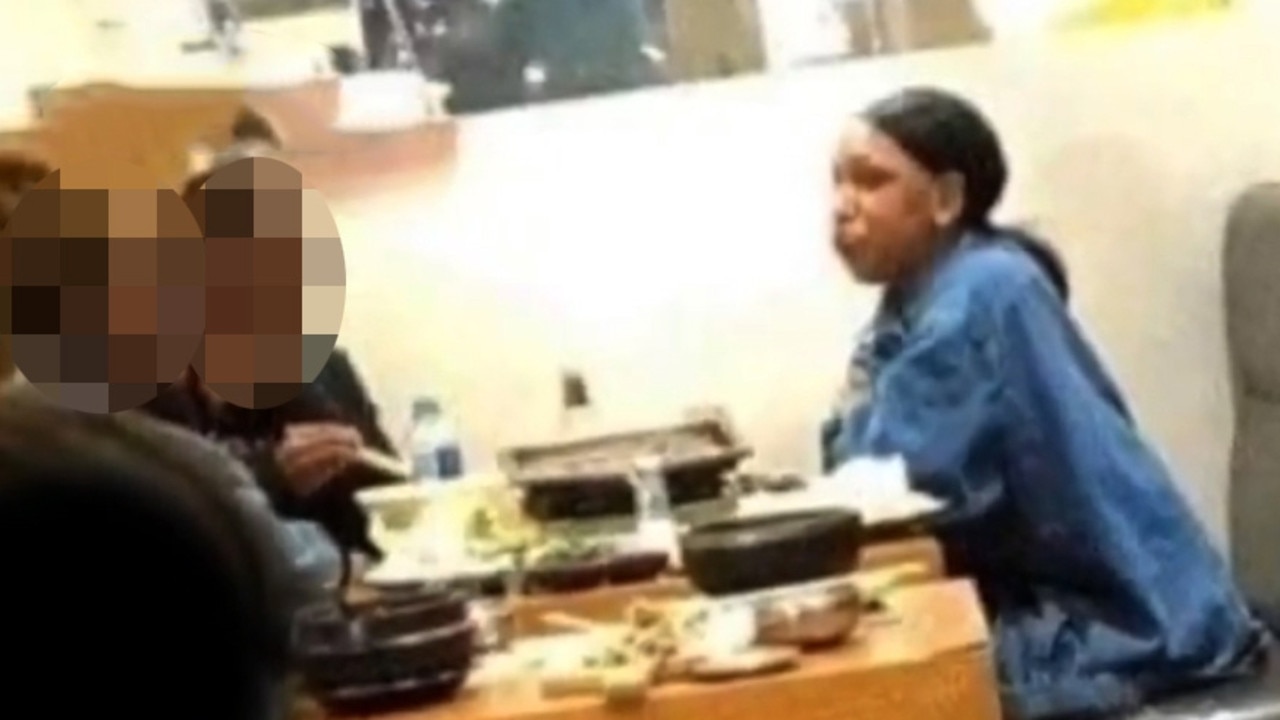 One of three girls who lied about visiting Victoria dines at a Brisbane Korean restaurant where she infected a man and his wife. Picture: Channel 7