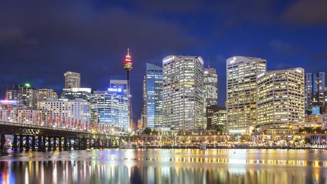 Sydney skyline and Pyrmont bridge at dusk near Darling Harbour, in Sydney Australia