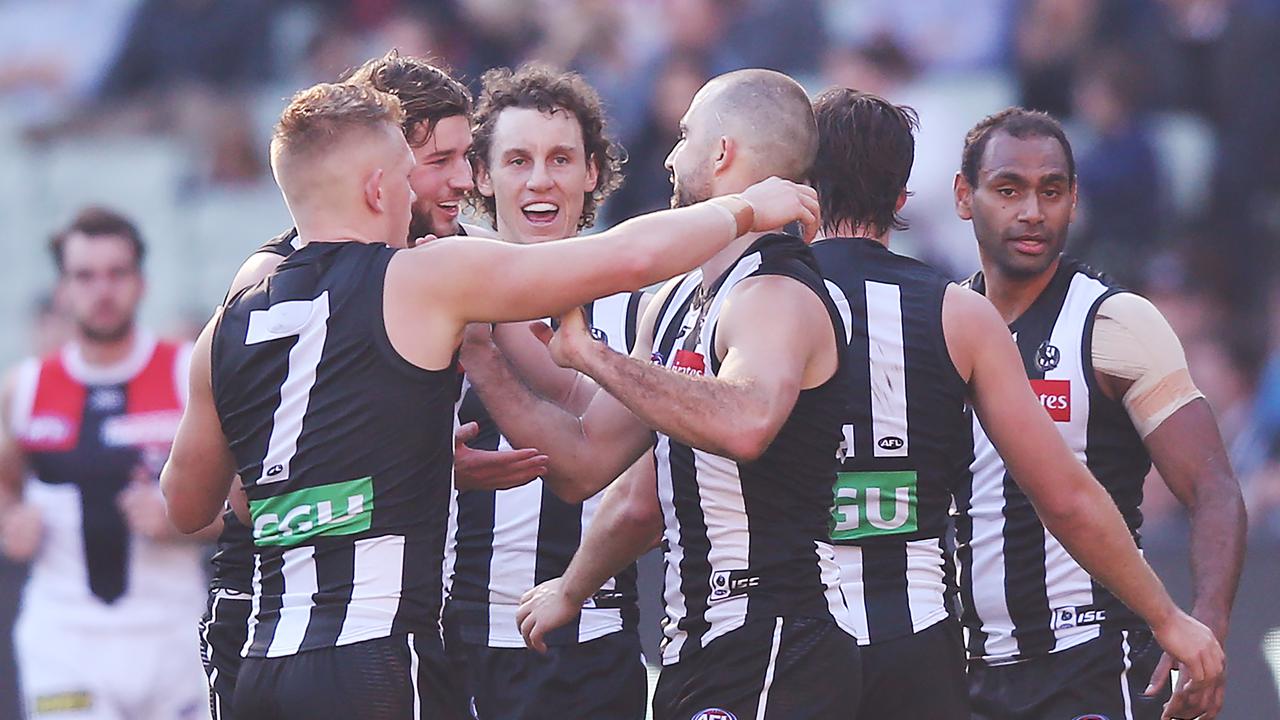Steele Sidebottom is mobbed after one of his two goals on Saturday.