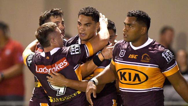 BRISBANE, AUSTRALIA - FEBRUARY 29: Xavier Coates of the Broncos is congratulated by team mates after scoring a try during the NRL Trial match between the Brisbane Broncos and the Gold Coast Titans at Redcliffe on February 29, 2020 in Brisbane, Australia. (Photo by Bradley Kanaris/Getty Images)