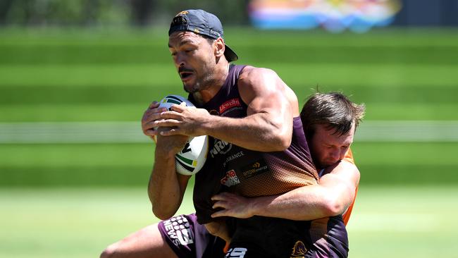 BRISBANE, AUSTRALIA - MARCH 12: Alex Glenn is tackled during a Brisbane Broncos NRL Training Session at Red Hill on March 12, 2019 in Brisbane, Australia. (Photo by Bradley Kanaris/Getty Images)