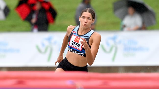 Izobelle Louison-Roe of Port Hacking on her way to a hurdles win. Pic: Jeremy Piper