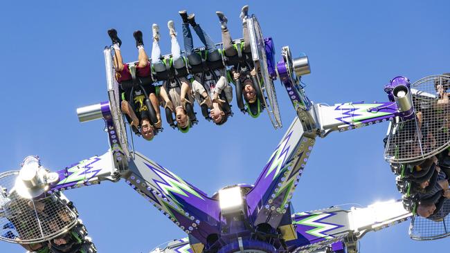 Thrillseekers in sideshow alley at the Ekka. Picture: Richard Walker