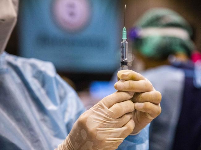 BANGKOK, THAILAND - AUGUST 30: Thai nurses prepare doses of the Pfizer Vaccine for patients at Cenral Westgate Mall on August 30, 2021 in Bangkok, Thailand. High risk Nonthaburi Province residents, who registered via the "Non Prom" app, received their first dose of the Pfizer-BioNTech COVID-19 Vaccine at Central Westgate Mall. Starting at 8am and concluding at 3pm, nurses and volunteers at Central Westgate provide mRNA vaccines to 9,000 Thai's. Those who qualified for the vaccine are over the age of 60, pregnant, or have pre-existing conditions.  (Photo by Lauren DeCicca/Getty Images)