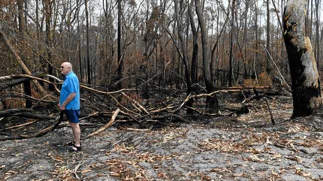 Geoff MacOibicin stands at his home where fire threatened homes at Wardell when it pushed right up to the back of properties at Lindsay Crescent. Picture: Marc Stapelberg