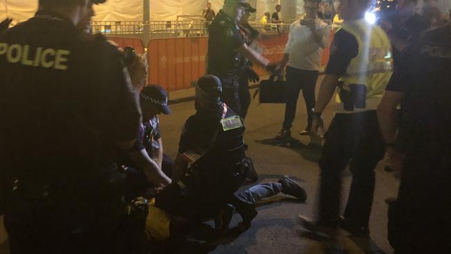 Aboriginal protesters are arrested by police at the Commonwealth Games opening ceremony. Photo: Britt Ramsey