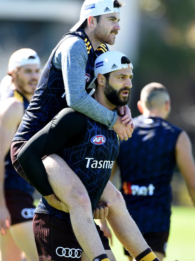 David Mirra with teammate Teia Miles at a Hawthorn training session this year.