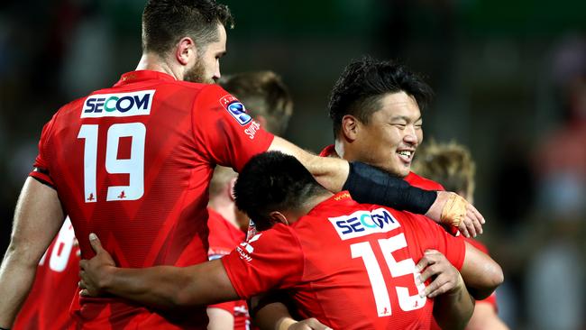 Sunwolves players (l-r) Tom Rowe, Jason Emery and Hiroshi Yamashita celebrate their round three win over the Chiefs earlier this month. Picture: Getty Images