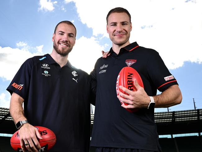 MELBOURNE, AUSTRALIA - JUNE 03: Harry McKay of the Blues   and Ben McKay of the Bombers pose during an AFL media opportunity at Melbourne Cricket Ground on June 03, 2024 in Melbourne, Australia. (Photo by Quinn Rooney/Getty Images)