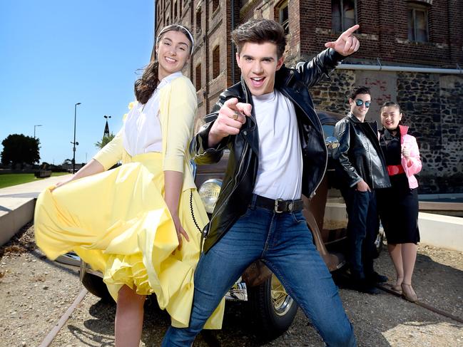 2/10/2020 - Adelaide Youth Theatre ÃGreaseÃ cast members (L-R) Olivia Giameos (Sandy), Nathan Stafford (Danny), Kristian Latella (Kenickie) and Taylor Tran (Rizzo) with a 1935 Ford Sedan at HartÃs Mill in Port Adelaide.After have to postpone their two shows earlier in the year due to COVID, the Adelaide Youth Theatre are super excited to have their young performers back on stage, for Grease! They will be performing the first 'live show' at the Arts Theatre since March. Picture: Naomi Jellicoe