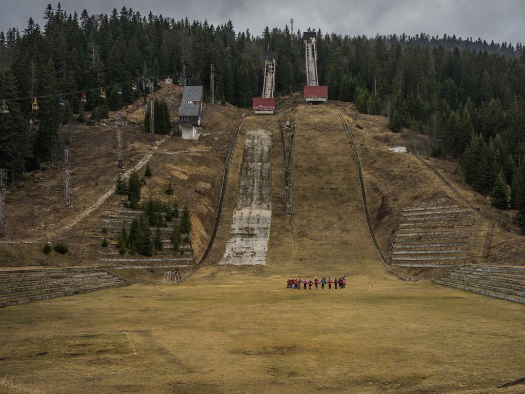 Children gather at foot of the 1984 Olympic Ski jump hill at Igman