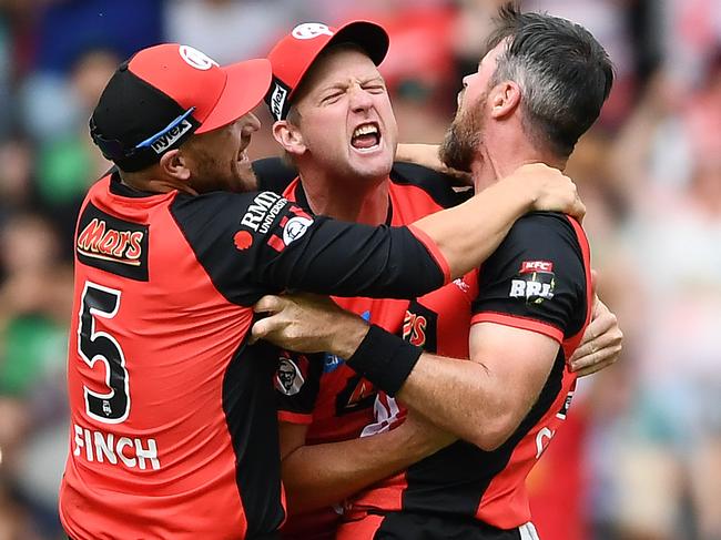 MELBOURNE, AUSTRALIA - FEBRUARY 17: Aaron Finch, Cameron White and Dan Christian of the Melbourne Renegades celebrate winning the Big Bash League Final match between the Melbourne Renegades and the Melbourne Stars at Marvel Stadium on February 17, 2019 in Melbourne, Australia. (Photo by Quinn Rooney/Getty Images)