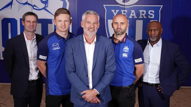 North Melbourne chairman Ben Buckley (centre) with general manager of football Brady Rawlings, captain Jack Ziebell, coach Rhyce Shaw and chief executive Ben Amarfio. Picture: AAP