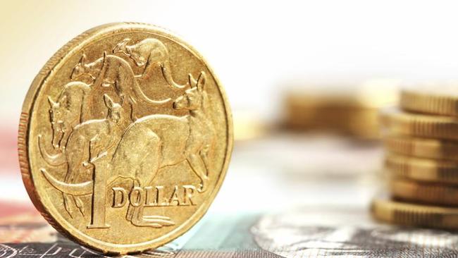 Aussie one dollar coins, on a twenty dollar note.