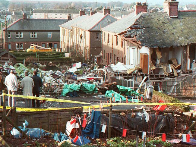 Lockerbie on December 22, 1988, the day after the terrorist bombing with locals staring at the devastation in their tiny town.