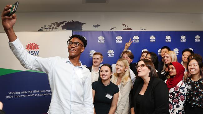 Pictured in Sydney at a special event celebrating the 2020 HSC First in Course recipients is Andrew Malcolm tales a selfie with fellow HSC score toppers and the NSW Education Minister Sarah Mitchell. Picture: Richard Dobson