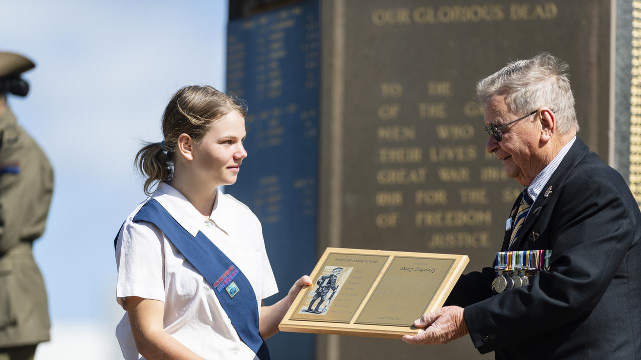 Daisy Zagorsky is presented the Spirit of Anzac Award by Lindsay Morrison at the Anzac Day Toowoomba mid-morning Service of Remembrance at the Mothers' Memorial, Tuesday, April 25, 2023. Picture: Kevin Farmer