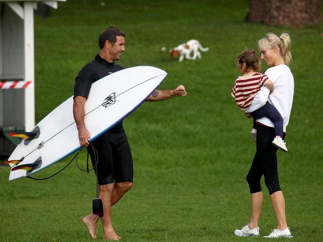 Doting dad Andrew 'Joey' Johns with partner Kate Kendall and daughter Alice after a surf at Bronte today. Picture: Toby Zerna