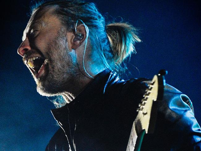 (FILES) Thom Yorke, lead singer of the British band Radiohead, performs at the Optimus Alive music festival at Alges, in this July 15, 2012, file photo in Lisbon. Art-house rockers Radiohead offered a Christmas surprise on December 25, 2015-- a new song, initially intended for the latest James Bond film. The British band, which has not released an album since 2011 amid persistent speculation about new recordings, said it had been asked to write the theme for "Spectre," the latest installment in the series about the dashing secret agent. "Yes we were," Radiohead wrote on its website, as if anticipating fans' doubts. "It didn't work out, but became something of our own, which we love very much," the band wrote. AFP PHOTO/PATRICIA DE MELO MOREIRA/FILES