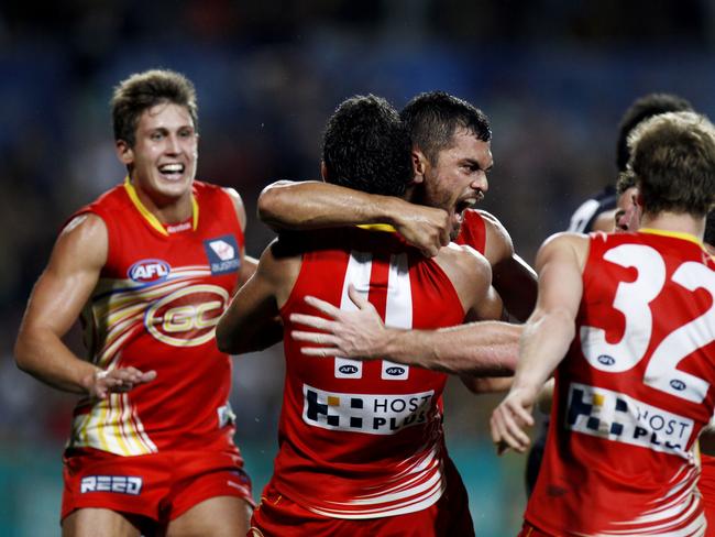 Karmichael Hunt celebrates after kicking the winning goal after the siren