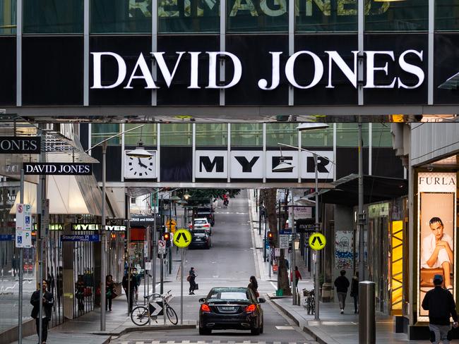 MELBOURNE, AUSTRALIA - JULY 09: A quiet little bourke street near Myer, David Jones and the Emporium on July 09, 2020 in Melbourne, Australia. Lockdown measures across metropolitan Melbourne and the Mitchell shire came into effect at midnight, with Victorian residents of those areas under stay at home orders for the next six weeks. Under the new lockdown restrictions, people will only able to leave home have for exercise or work, to buy essential items including food or to access childcare and healthcare. Victorians cannot gather in groups of more than two or their household group, school holidays will be extended for at least a week. Retail can remain open and markets are permitted to open for food and drink only. Cafes, restaurants, pubs, clubs and bars are back to takeaway only. (Photo by Asanka Ratnayake/Getty Images)