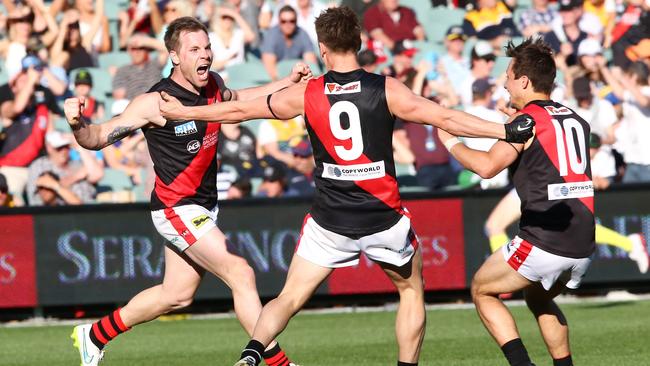 Shannon Green celebrates a late goal with Aaron Fielke and Kaine Stevens in the 2015 SANFL grand final. Picture: Sarah Reed.