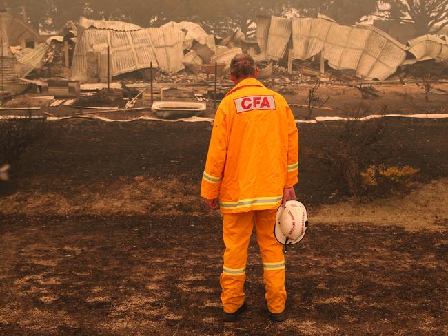 CFA fire chief Steve Warrington at a destroyed house in Buchan. Picture: David Crosling