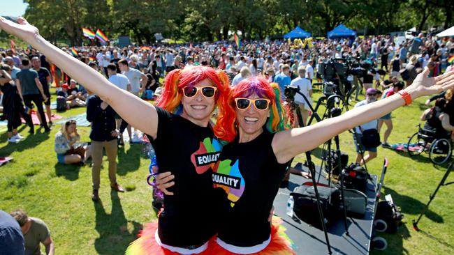 Sharlini Scholtz and Devon Indig join marriage equality supporters celebrating the survey result at Prince Alfred Park in Surry Hills, Sydney. Picture: Toby Zerna