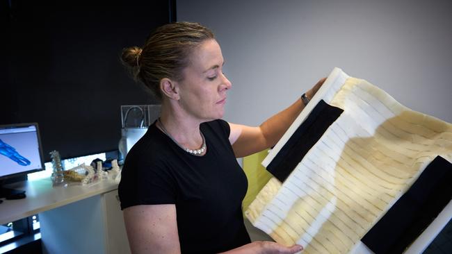 QUT Dr Paige Little with one of the mattress supports. Picture: Patria Jannides Photography