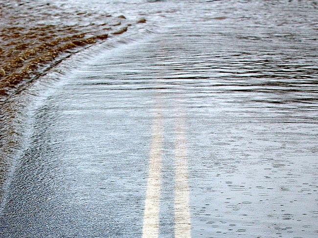 Floodwaters cover Brush Road , Ourimbah . Generic flood / closed roads pic . 13/5/03 . Picture: Troy Snook