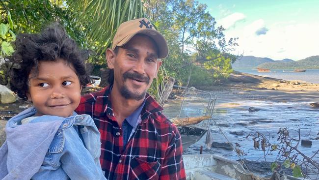 Alayah Yeatman, 4, and her dad Horace Yeatman, 34, a Gunggandji man, live on the water in the Local Thriving Community of Yarrabah.