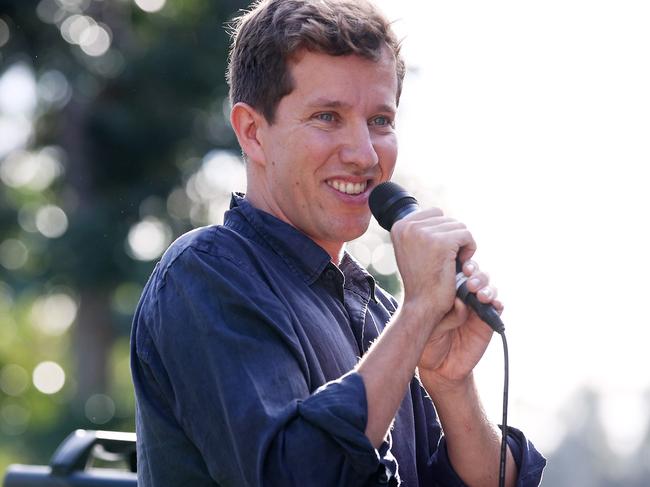 Greens candidate for Griffith Max Chandler-Mather during a rally outside Brisbane Airport Corporation against fight noise. Pics Tara Croser.