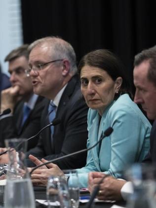 Gladys Berejiklian (second from right) is pictured during a press conference announcing that all mass gatherings of 500 people or more are cancelled from Monday 16th of March. Picture: AAP