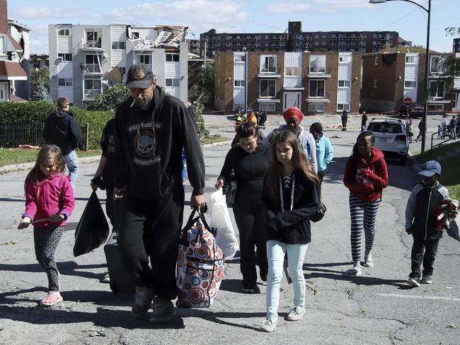 Residents leave with some of their belongings from a Gatineau, Quebec, Canada neighbourhood. Picture: Fred Chartrand/The Canadian Press via AP