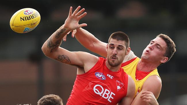 Sam Naismith and Darcy Cameron in a ruck contest at Swans training, prior to Naismith’s ACL injury.