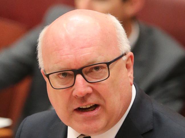Attorney General Senator George Brandis respond to questions from the Greens during Question Time in the Senate in Canberra today. Picture: Ray Strange.