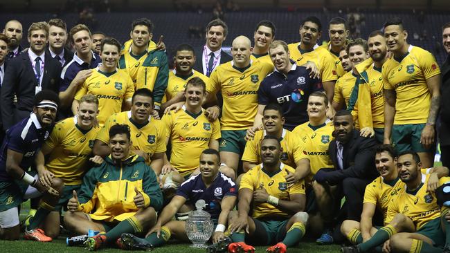 Australia pose with the Hopetoun Cup after defeating Scotland at Murrayfield.