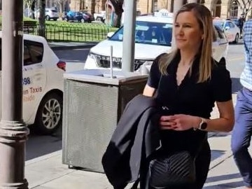 Teacher, marathon runner and mother Julia Hodge outside the District Court. Picture: Sean Fewster