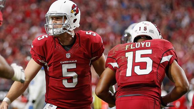 Quarterback Drew Stanton #5 of the Arizona Cardinals congratulates wide receiver Michael Floyd.
