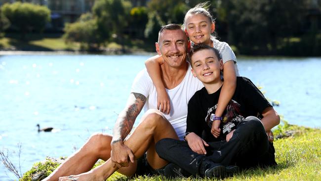 Mat Rogers with children Max and Phoenix. Picture: Adam Head