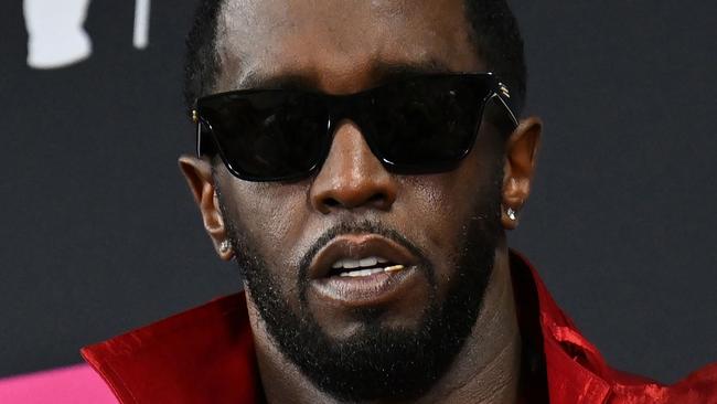 (FILES) US producer-musician Sean "Diddy" Combs poses with the Global Icon award in the press room during the MTV Video Music Awards at the Prudential Center in Newark, New Jersey, on September 12, 2023. A judge denied Combs bail on November 27, 2024, according to a court filing, after he was charged with sex trafficking and racketeering. Judges had already denied bail twice for the rapper and prosecutors alleged in opposing the third bid that the rapper and producer has contacted witnesses and used unauthorized communications platforms while incarcerated. (Photo by ANGELA WEISS / AFP)